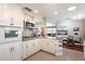 Bright kitchen features granite counters, white cabinets, and stainless steel appliances at 1939 E Solano Dr, Phoenix, AZ 85016