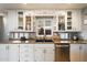 Bright kitchen features granite counters, white cabinets, and stainless steel appliances at 1939 E Solano Dr, Phoenix, AZ 85016