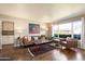 Bright living room boasts wood floors, a large picture window, and modern furnishings at 1939 E Solano Dr, Phoenix, AZ 85016