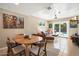 Versatile living space with pool access has tile floors and comfortable furniture at 1939 E Solano Dr, Phoenix, AZ 85016