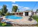 Inviting pool area with comfortable lounge chairs, lush landscaping, and a patio perfect for entertaining at 1939 E Solano Dr, Phoenix, AZ 85016
