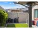 Low-maintenance backyard with artificial grass, barbecue setup, and scenic mountain views at 21387 W Meadowbrook Ave, Buckeye, AZ 85396