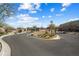 Welcoming gated community entrance with well-maintained landscaping and clear signage for an upscale feel at 21387 W Meadowbrook Ave, Buckeye, AZ 85396