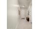 Bright and airy foyer featuring neutral walls, tile flooring, a bench, and access to other rooms at 21387 W Meadowbrook Ave, Buckeye, AZ 85396