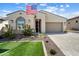 Charming single-Gathering home featuring a neat lawn, garden, and a convenient two-car garage at 21387 W Meadowbrook Ave, Buckeye, AZ 85396