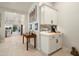 Hallway view of a coffee bar, table, and view into the rest of the house at 21387 W Meadowbrook Ave, Buckeye, AZ 85396