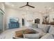 Comfortable living room featuring a plush sectional sofa, modern furniture, and a seamless flow to the kitchen at 21387 W Meadowbrook Ave, Buckeye, AZ 85396
