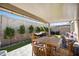 Covered patio area with outdoor seating and BBQ at 21387 W Meadowbrook Ave, Buckeye, AZ 85396