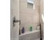 An accessible shower stall complete with built-in bench and convenient grab bar at 21387 W Meadowbrook Ave, Buckeye, AZ 85396