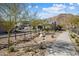 Charming homes along the street with a mountain backdrop offer a picturesque and desirable neighborhood setting at 21387 W Meadowbrook Ave, Buckeye, AZ 85396