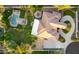Aerial view of a luxury home showcasing a pool, patios, lush landscaping, and circular driveway at 2174 E Avenida Del Valle Ct, Gilbert, AZ 85298