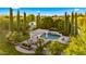 Beautiful backyard featuring a pool, spa, gazebo, and outdoor seating, surrounded by lush landscaping at 2174 E Avenida Del Valle Ct, Gilbert, AZ 85298