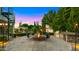 Entertainer's backyard featuring a fire pit, outdoor kitchen, spiral staircase, and lush landscaping for ultimate outdoor living at 2174 E Avenida Del Valle Ct, Gilbert, AZ 85298