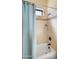 Clean bathroom showcasing a tub with tiled walls and a neutral color palette, creating a peaceful and inviting space at 2174 E Avenida Del Valle Ct, Gilbert, AZ 85298