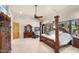 Inviting bedroom features a four-poster bed, dresser, and plenty of natural light at 2174 E Avenida Del Valle Ct, Gilbert, AZ 85298