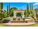 Beautiful cabana with tile roof overlooks manicured lawn and lush landscaping, creating a resort-like backyard oasis at 2174 E Avenida Del Valle Ct, Gilbert, AZ 85298