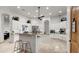 Spacious kitchen featuring white cabinetry, granite countertops, stainless steel appliances, and two islands at 2174 E Avenida Del Valle Ct, Gilbert, AZ 85298