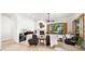 Comfortable living room with a fireplace, large windows, and plush leather seating at 2174 E Avenida Del Valle Ct, Gilbert, AZ 85298