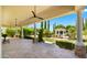 Spacious outdoor patio with seating areas and elegant landscaping, perfect for enjoying the beautiful backyard view at 2174 E Avenida Del Valle Ct, Gilbert, AZ 85298