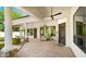 Elegant covered patio area featuring stone pillars, ceiling fans, and ample space for relaxing at 2174 E Avenida Del Valle Ct, Gilbert, AZ 85298