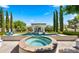 Inviting backyard showcasing a pristine pool, spa, and cabana perfect for relaxation and entertainment at 2174 E Avenida Del Valle Ct, Gilbert, AZ 85298