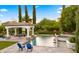 Gorgeous backyard showcasing a private pool, spa, covered patio, and lush landscaping, creating a serene retreat at 2174 E Avenida Del Valle Ct, Gilbert, AZ 85298