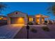 Inviting single-Gathering home with a neutral exterior, two-car garage, and attractive landscaping at 21913 N Pedregosa Ct, Sun City West, AZ 85375
