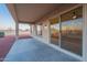 Covered patio with a fan and sliding door at 21913 N Pedregosa Ct, Sun City West, AZ 85375