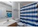 This bathroom features a vanity, mirror, toilet, and shower with curtain at 23306 S 221St St, Queen Creek, AZ 85142