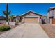 Charming single-Gathering home with a two-car garage, desert landscaping, and a stucco exterior at 23306 S 221St St, Queen Creek, AZ 85142
