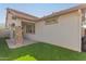 Low angle shot of the backyard with artificial turf at 2580 E Boston St, Gilbert, AZ 85295