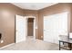 Bedroom with carpet and a closet with sliding doors at 2580 E Boston St, Gilbert, AZ 85295