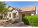 Inviting single-story home with a tiled roof, stone accents, and desert-friendly landscaping at 2580 E Boston St, Gilbert, AZ 85295