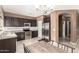 Modern kitchen featuring stainless steel appliances, dark cabinetry, and tile backsplash at 2580 E Boston St, Gilbert, AZ 85295
