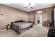Main bedroom with ceiling fan and ensuite bathroom at 2580 E Boston St, Gilbert, AZ 85295