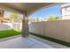 Covered patio featuring stone columns and view of landscaped backyard at 2580 E Boston St, Gilbert, AZ 85295