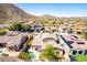 Beautiful aerial view of desert home featuring a pool, mature landscaping and access to community amenities at 26015 N 85Th Dr, Peoria, AZ 85383
