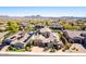 Expansive aerial view of a desert home showcasing the beautiful tile roof and desert landscaping at 26015 N 85Th Dr, Peoria, AZ 85383