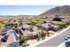 Beautiful aerial shot of a neighborhood with mountain views, landscaping, and desert foliage at 26015 N 85Th Dr, Peoria, AZ 85383