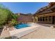 Inviting backyard featuring a sparkling pool, a covered patio, and desert-friendly landscaping at 26015 N 85Th Dr, Peoria, AZ 85383