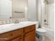 Bathroom vanity with updated countertops, sink, cabinet, and shower and toilet visible at 26015 N 85Th Dr, Peoria, AZ 85383