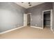 Comfortable bedroom with soft carpeting and a connected closet for easy access and storage at 26015 N 85Th Dr, Peoria, AZ 85383