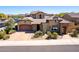 Attractive desert home with desert landscaping, featuring a tile roof and a two-car garage at 26015 N 85Th Dr, Peoria, AZ 85383
