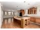 Kitchen featuring a peninsula with bar seating and open to the living and dining areas at 26015 N 85Th Dr, Peoria, AZ 85383