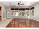 Living room features wood-look floors, tiled floors, and a view of the backyard at 26015 N 85Th Dr, Peoria, AZ 85383
