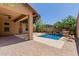 Charming backyard with covered patio, pool, and low-maintenance landscaping, perfect for relaxing at 26015 N 85Th Dr, Peoria, AZ 85383
