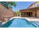 Private backyard featuring a refreshing pool and covered patio, creating an ideal outdoor living space at 26015 N 85Th Dr, Peoria, AZ 85383