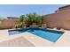 Serene backyard oasis showcasing a stunning pool and lush landscaping, ideal for outdoor enjoyment at 26015 N 85Th Dr, Peoria, AZ 85383