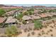An aerial view of a home featuring a private backyard with desert landscaping, covered patio, and outdoor dining area at 28351 N 130Th Dr, Peoria, AZ 85383