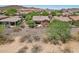 Aerial view of a backyard boasting a covered patio, outdoor dining area, lounge chairs, and desert landscaping at 28351 N 130Th Dr, Peoria, AZ 85383